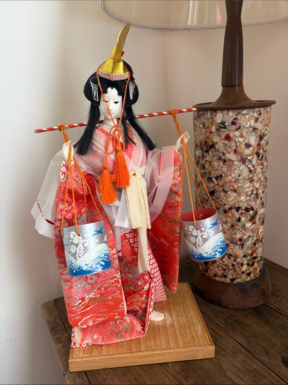 Vintage Geisha doll in traditional dress.